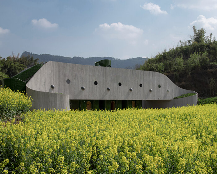 folded agricultural complex doubles as bridge and public toilet in rural china